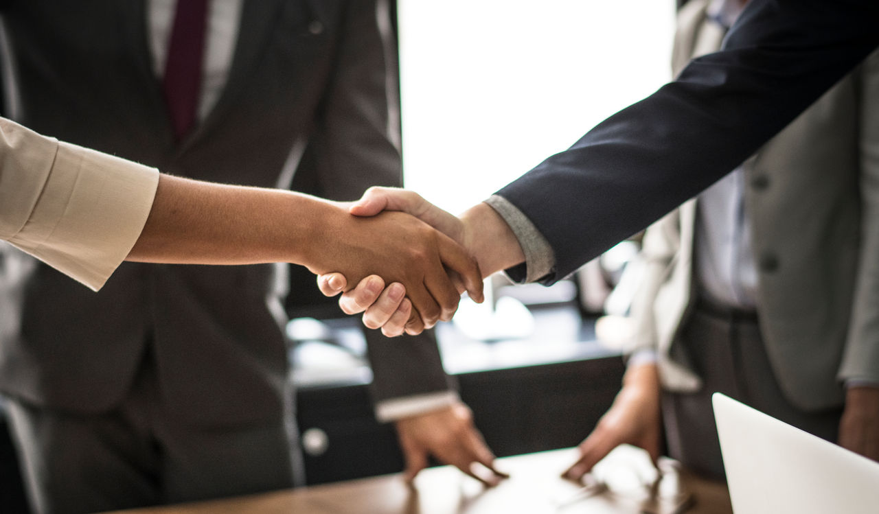 Business people shaking hands in a meeting room