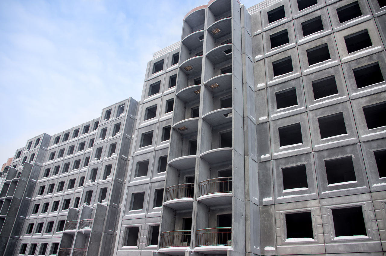 Unfinished building of reinforced concrete panels without windows; Shutterstock ID 170797346