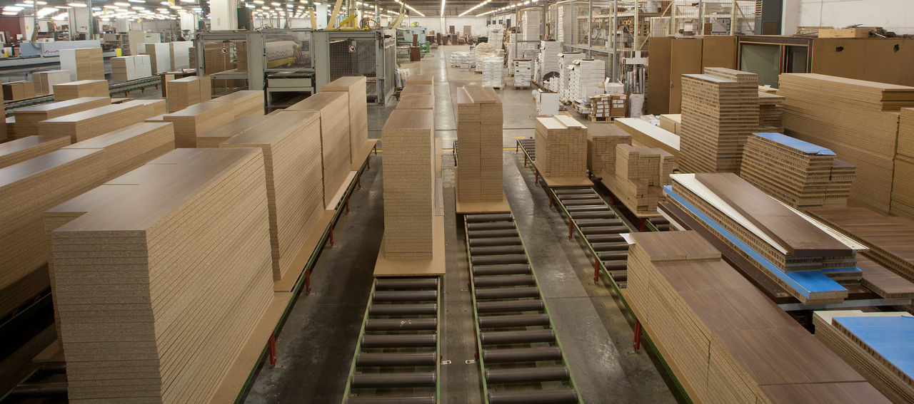 The MDF factory has a nice panoramic image with the MDFs stacked on top of each other. ; Shutterstock ID 1109030867; purchase_order: CON; job: ; client: ; other: 