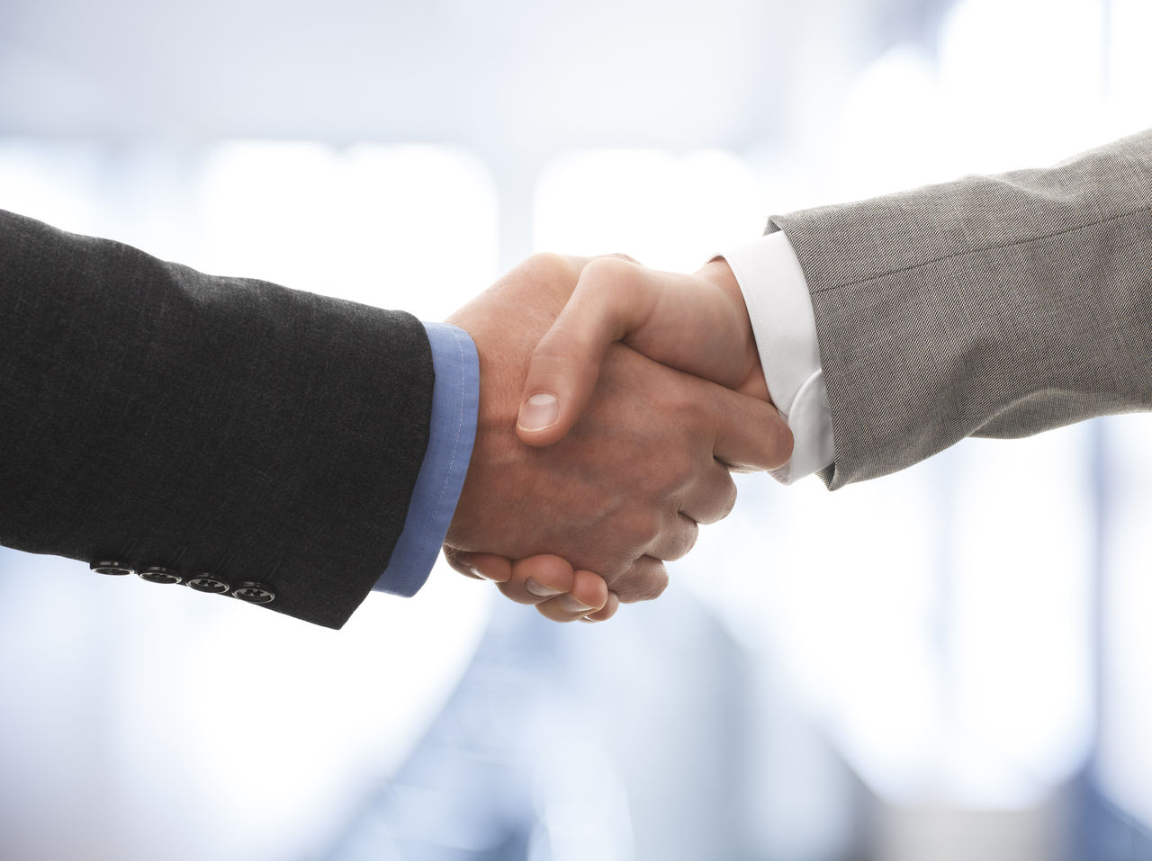 Two business men shaking hands; Shutterstock ID 134066510