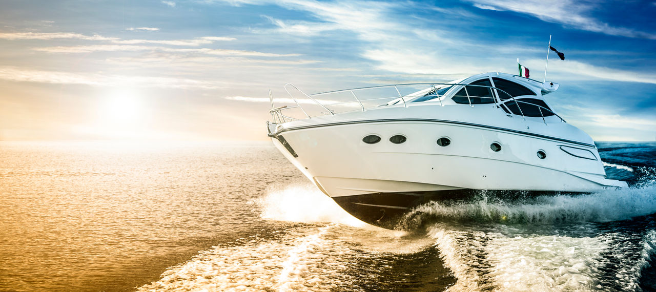 Motor boat sailing the sea at dawn