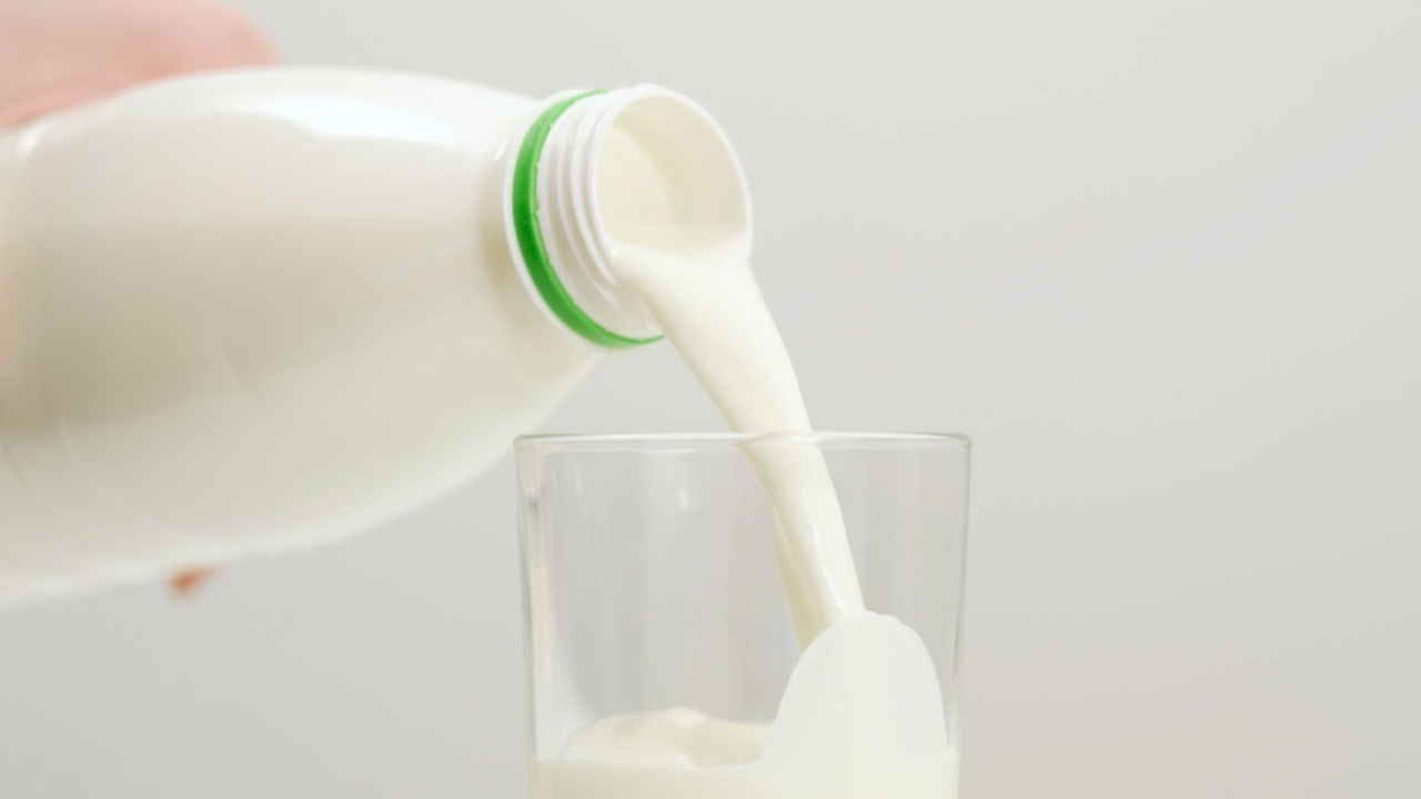 milk sipping from a bottle