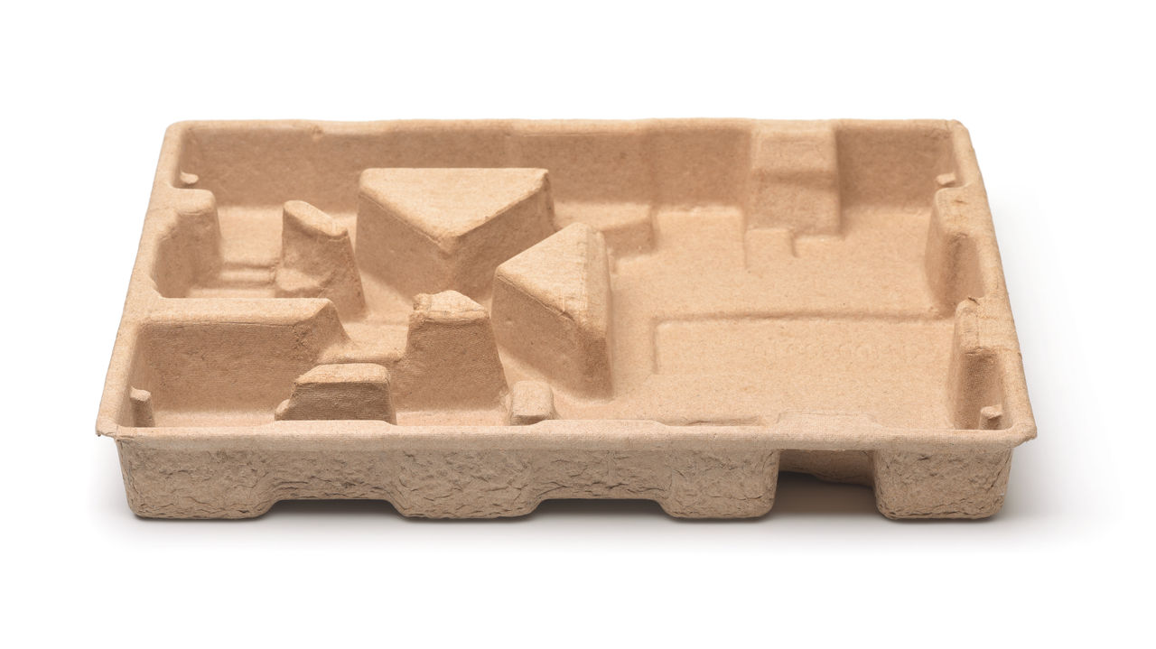 Empty molded pulp protective packaging tray
