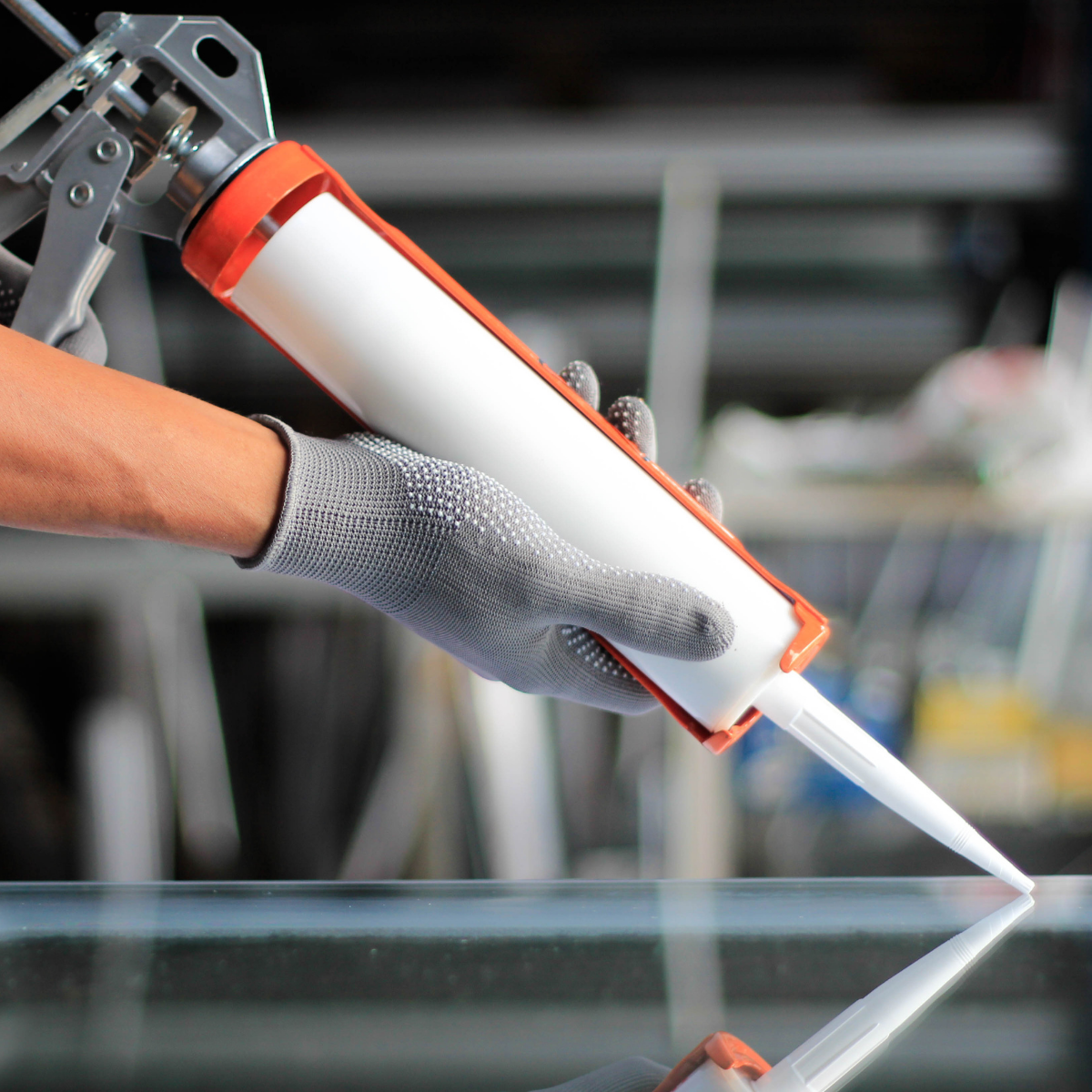  Application of sealant on a glass surface
