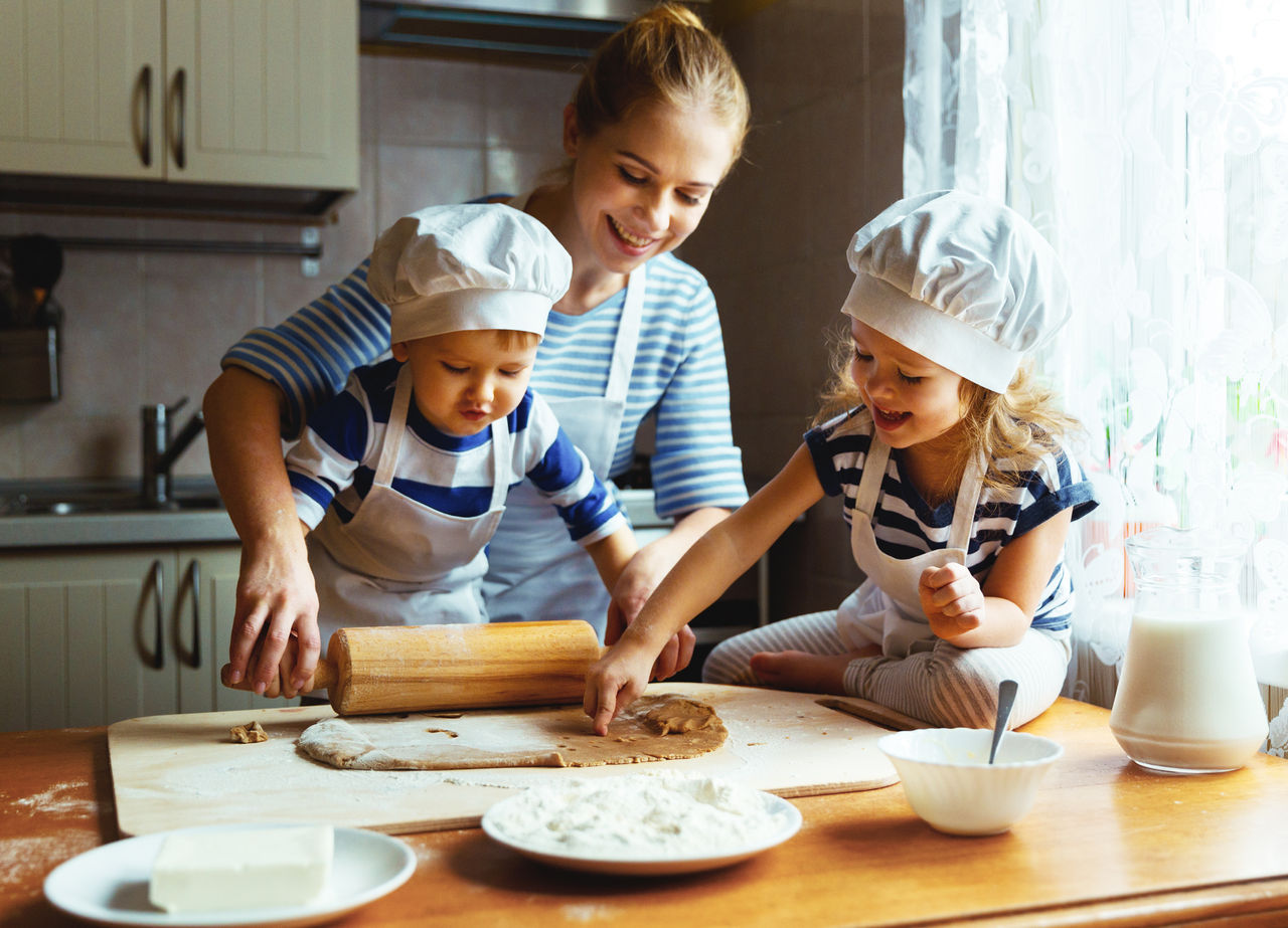 happy family in the kitchen. mother and  children preparing the dough, bake cookies
; Shutterstock ID 583771249