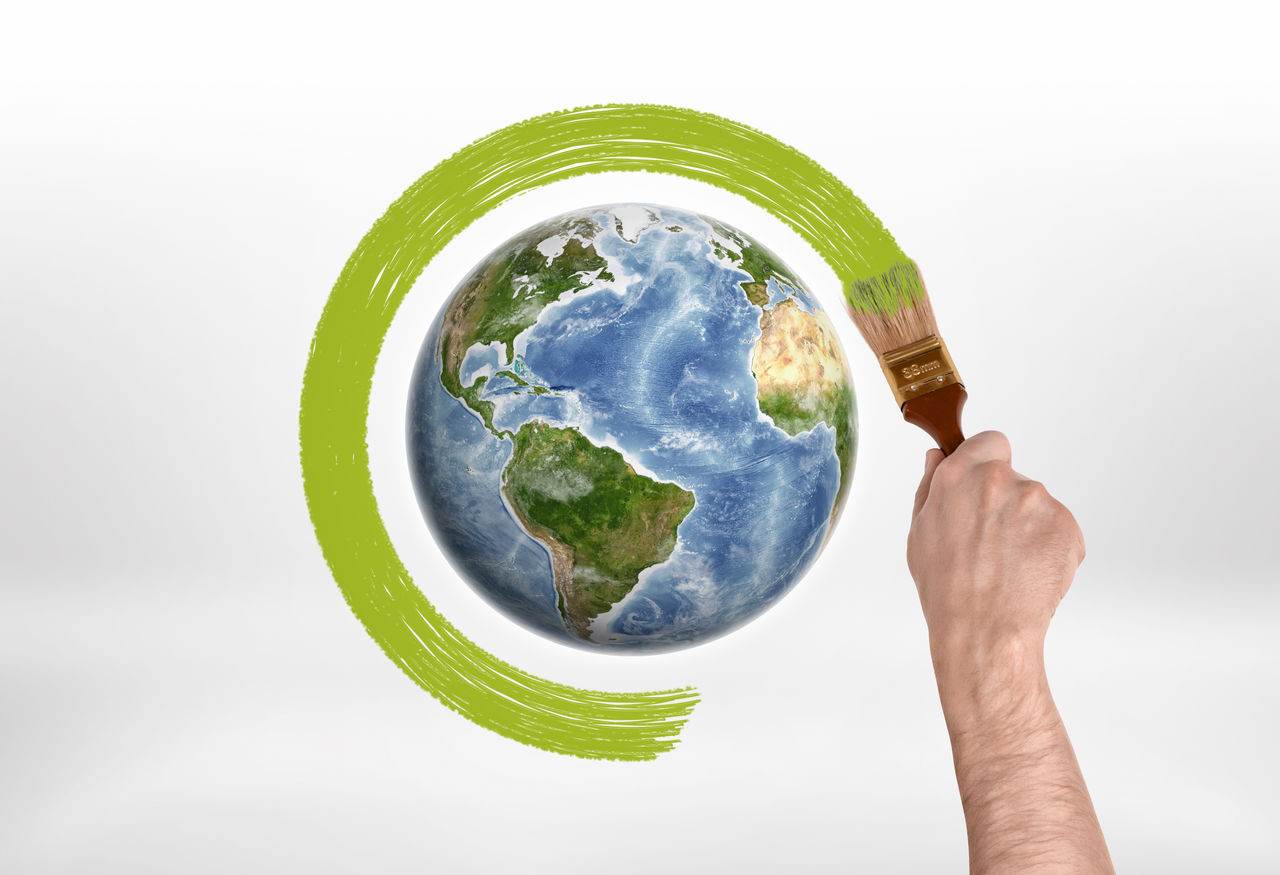 Man's hand encircles globe with a brush with green paint. Protection of the planet. Save planet. Environment and ecology.; Shutterstock ID 492636637; purchase_order: CON; job: CON; client: CON; other: CON
492636637