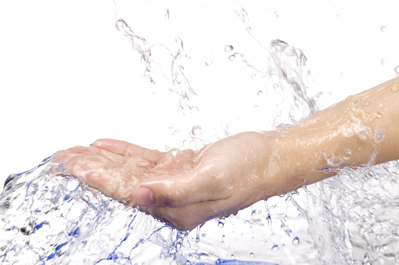 Water splashing on the hand on white background; Shutterstock ID 61227967; Purchase Order: EVS Water Treatment