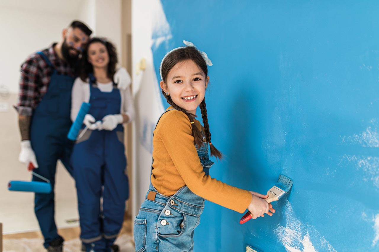 Happy family renovating their home. They are painting a wall together.; Shutterstock ID 1646906872; purchase_order: CON; job: ; client: ; other: 