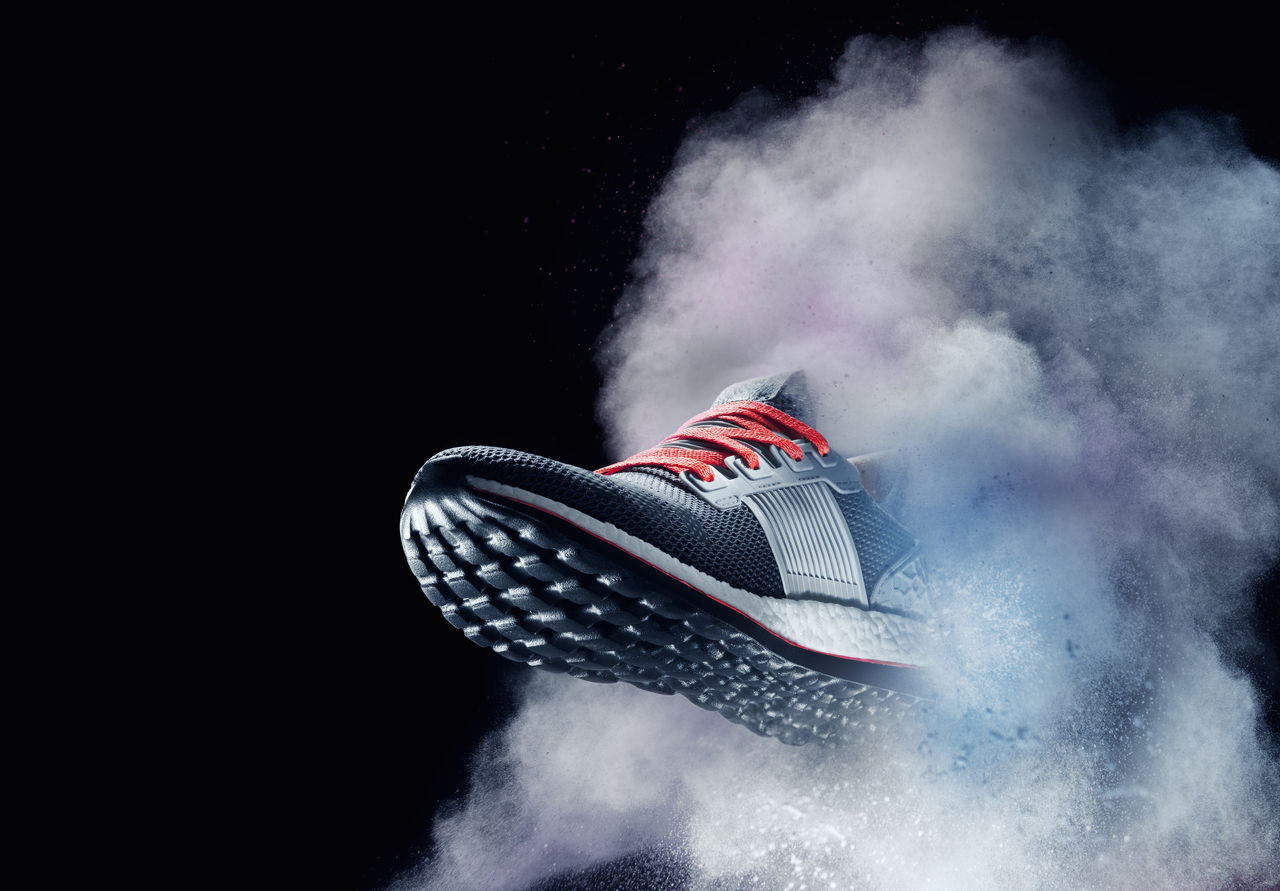 close up view of nice sport shoe is getting out of dusty cloud ; Shutterstock ID 657573118